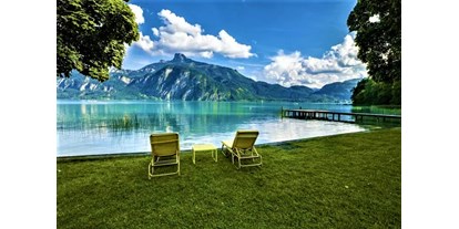 Hotels am See - Liegewiese direkt am See - Österreich - Entspannen direkt am Mondsee mit herrlichem Blick auf die Bergwelt - Hotel Seehof Mondsee