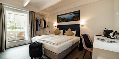 Hotels am See - Hotel unmittelbar am See - Deutschland - Doppelzimmer mit See- oder Gartenblick - Seehotel am Tankumsee