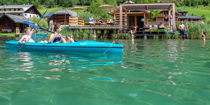 Hotels am See - Balkon - Weissensee - Badesteg mit Badehaus. Ein Ruderboot und 2 Stück 2er Kanus stehen Ihnen exklusiv zur Verfügung. - Im Franzerl am Weissensee