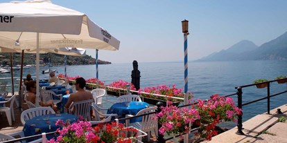 Hotels am See - Garten mit Seezugang - Gardasee - Verona - Assenza di Brenzone. Von hier aus können Sie die Fähre nehmen und den See überqueren.  - Hotel Eden Gardasee