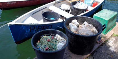 Hotels am See - Venetien - Die Fischerei ist eine der ältesten Lebensgrundlagen unserer Gemeinde. Noch heute wird es stark praktiziert und garantiert unseren Restaurants die beste Qualität von Seefisch.  - Hotel Eden Gardasee