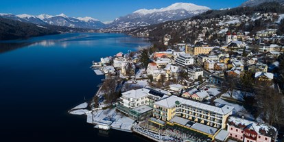 Hotels am See - Massagen - Kärnten - Luftaufnahme vom Hotel Forelle im Winter - Seeglück Hotel Forelle**** S Millstatt