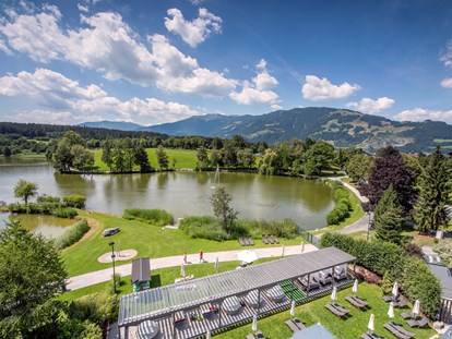Hotels am See - Sauna - Berg (Leogang) - Pergola und private Liegewiese am Ritzensee - Ritzenhof - Hotel und Spa am See