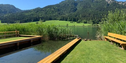 Hotels am See - Liegewiese direkt am See - Kärnten - Teil unseres Privatstrands - Wiesenhof****