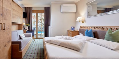 Hotels am See - Bachwinkl (Saalfelden am Steinernen Meer, Maria Alm am Steinernen Meer) - Komfortzimmer mit französischen Balkon und Klimaanlage - Hotel Fischerwirt
