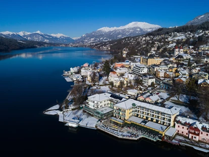 Hotels am See - Millstatt - Luftaufnahme vom Hotel Forelle im Winter - Seeglück Hotel Forelle**** S Millstatt
