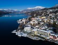 Urlaub am See: Luftaufnahme vom Hotel Forelle im Winter - Seeglück Hotel Forelle**** S Millstatt