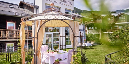 Hotels am See - Verpflegung: Frühstück - Paradiesgarten / Dachterrasse - RomantikHotel Zell Am See