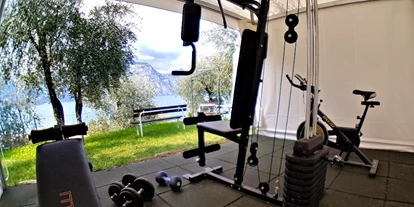 Hotels am See - Klassifizierung: 3 Sterne - Italien - Um fit zu bleiben, haben wir ein anständiges Fitnessstudio in unserem Garten. Die wichtigsten Werkzeuge für Ihr körperliches Wohlbefinden finden Sie hier.  - Hotel Eden Gardasee